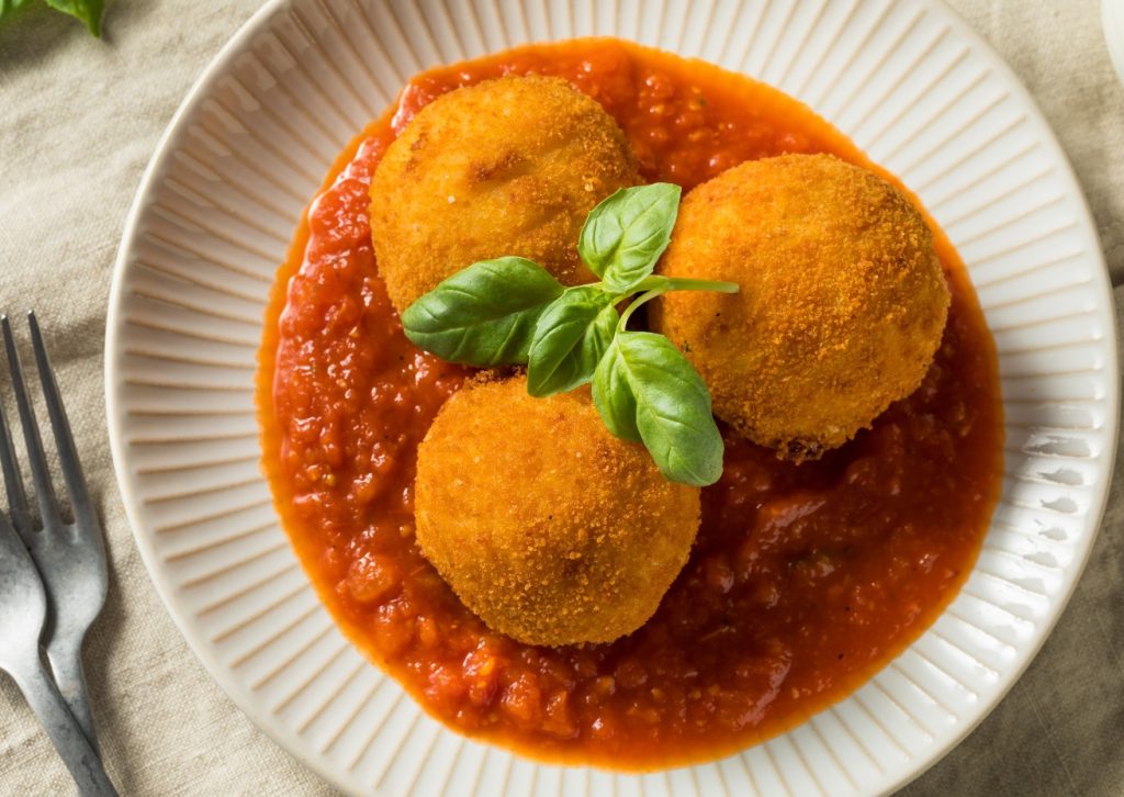 arancini di riso, lenticchie e cuore di cotechino